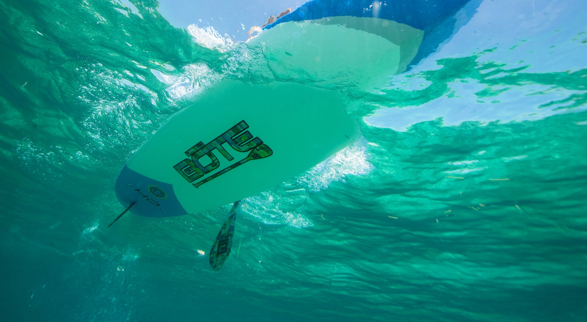 Underwater view showing HD Gatorshell board bottom with logo and fin.