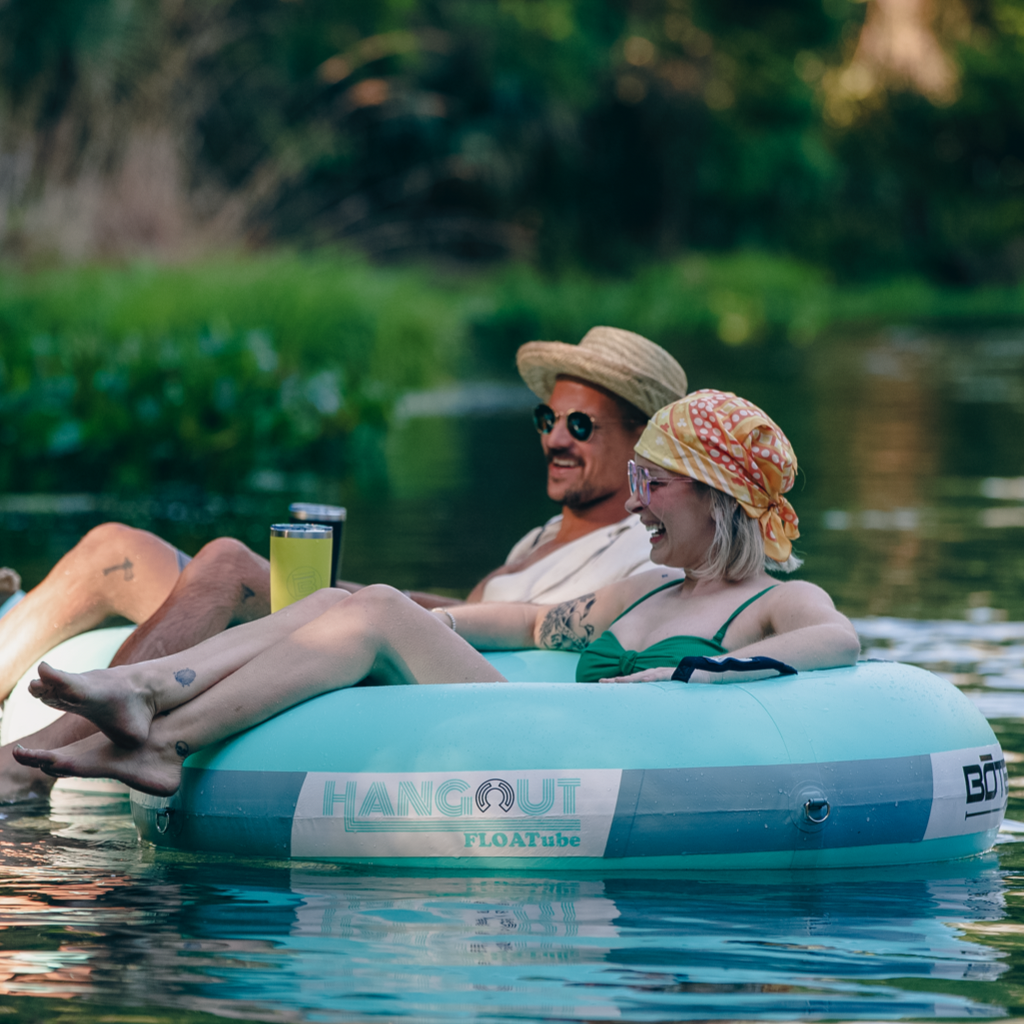 Two people floating on the Inflatable Hangout FLOATube Classic