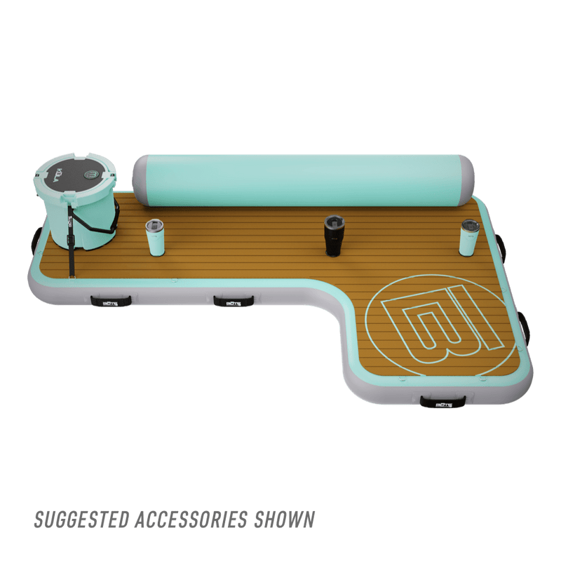 Angled view of the Inflatable Dock Hangout Couch [Starboard] Classic with drinkware and cooler