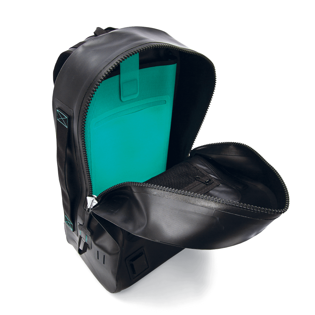 Interior of the black Highwater Backpack with laptop sleeve in seafoam