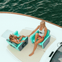 Woman and daughter sitting in their Aero Chairs on the bow of a boat