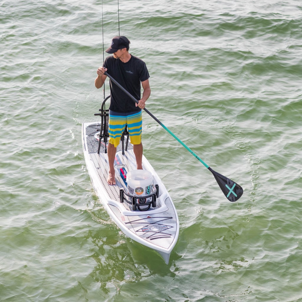 Man using an Axe 1-Piece paddle on his Rackham 12' Bug Slinger paddle board