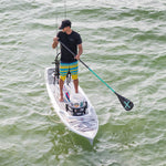 Man using an Axe 1-Piece paddle on his Rackham 12' Bug Slinger paddle board