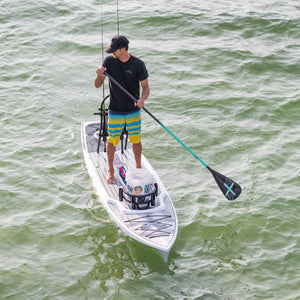 Man using an Axe 1-Piece paddle on his Rackham 12' Bug Slinger paddle board