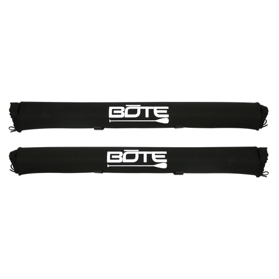 Two black roof rack pads with white BOTE logo