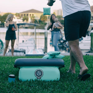 A person throwing a bag to the Inflatable Aero Bag Toss Classic