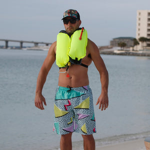 Man with the BOTE Inflatable Vest PFD inflated and around his chest