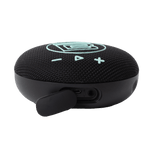 Angled view of speaker showing charging port area