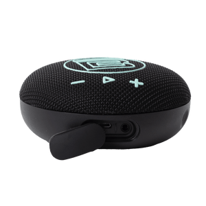 Angled view of speaker showing charging port area