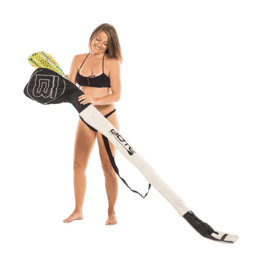 Women loading paddle into paddle bag