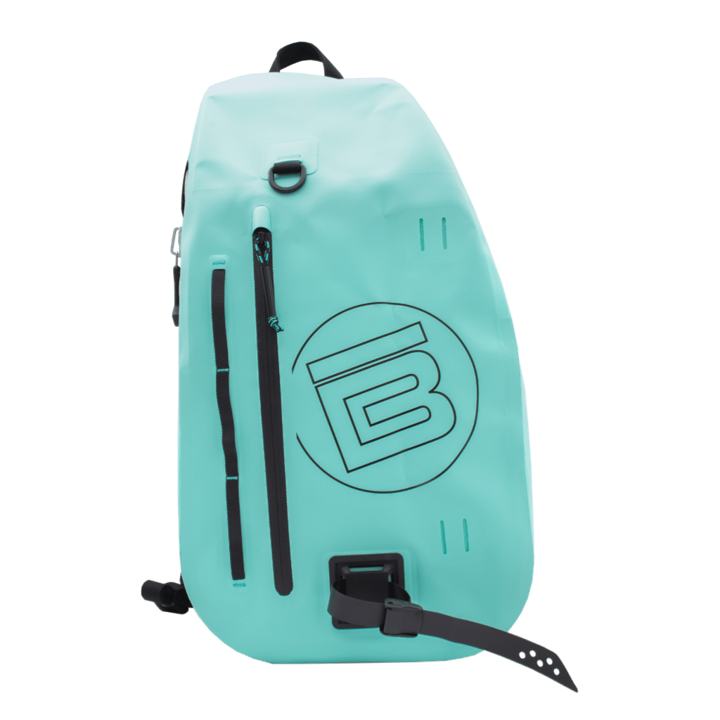 Front view of the Highwater Slingpack Seafoam with vertical zip pockets and black BOTE logo.