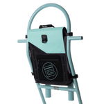 Angled view of the Highwater Tackle Pouch Seafoam secured to a rack on a board.