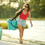 Woman using a KULA Travelink Carry Sling to carry her KULA 5 Cooler
