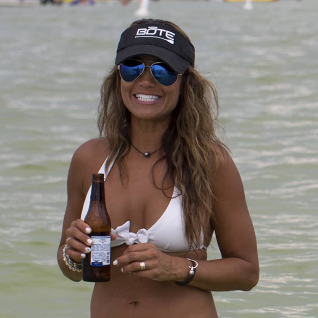 Person wearing Logo Visor in Black with white BOTE logo.