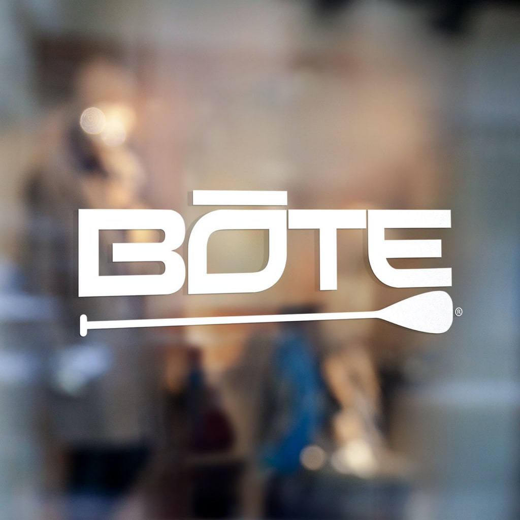 White BOTE logo decal with paddle design shown applied on a glass window.