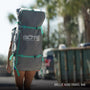 Woman carrying her Breeze Aero in it's travel bag as a backpack