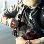 Zipping up the BOTE Adult Fishing PFD Vest